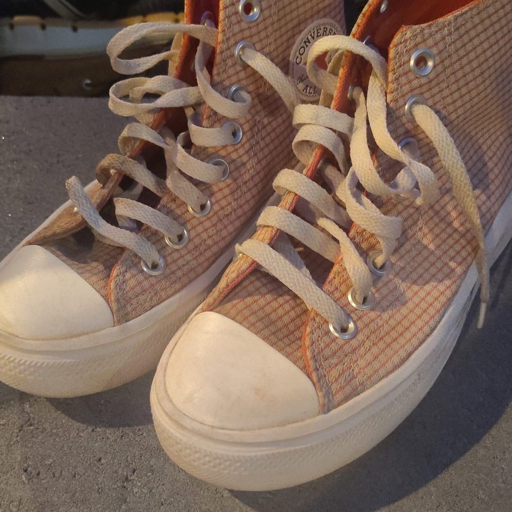 Converse High-Tops with Orange and Cream Checkered Design.